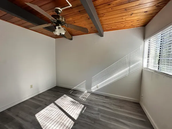 a view of hallway with wooden floor