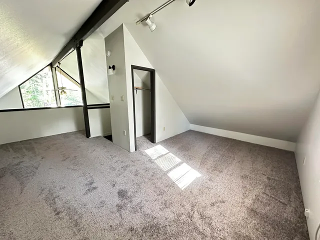 a view of wooden floor with a window
