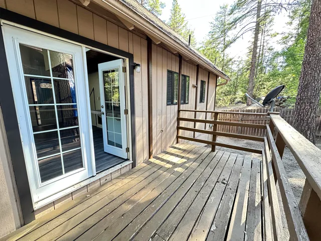 a view of a yard with large trees