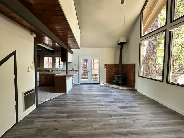 a kitchen with counter top space cabinets and wooden floor