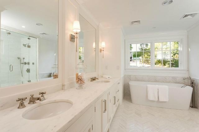 22 Point Road Norwalk, CT 06854 - Photo 12 of 24 a bathroom with a sink double vanity granite tub shower and a mirror