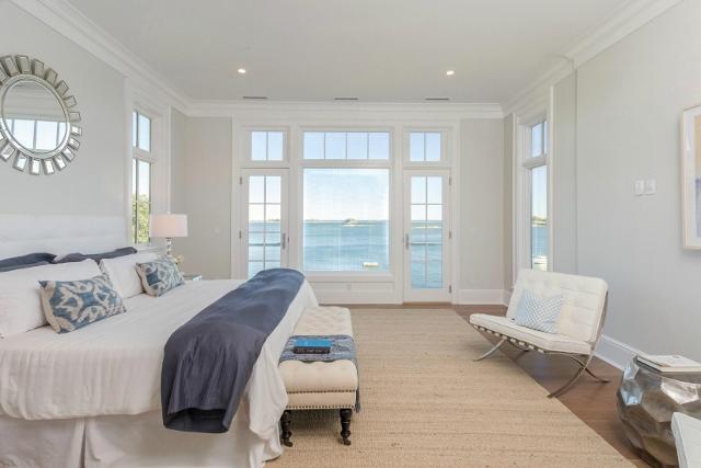 22 Point Road Norwalk, CT 06854 - Photo 10 of 24 a spacious bedroom with a bed and a large window