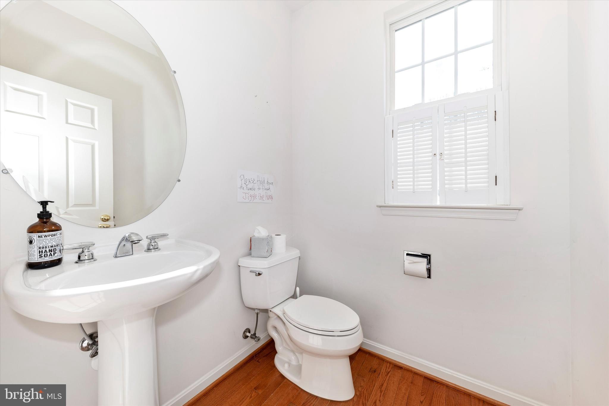 100 Sunlight Drive Frederick, MD 21702 - Photo 11 of 41 a bathroom with a sink a mirror and a toilet