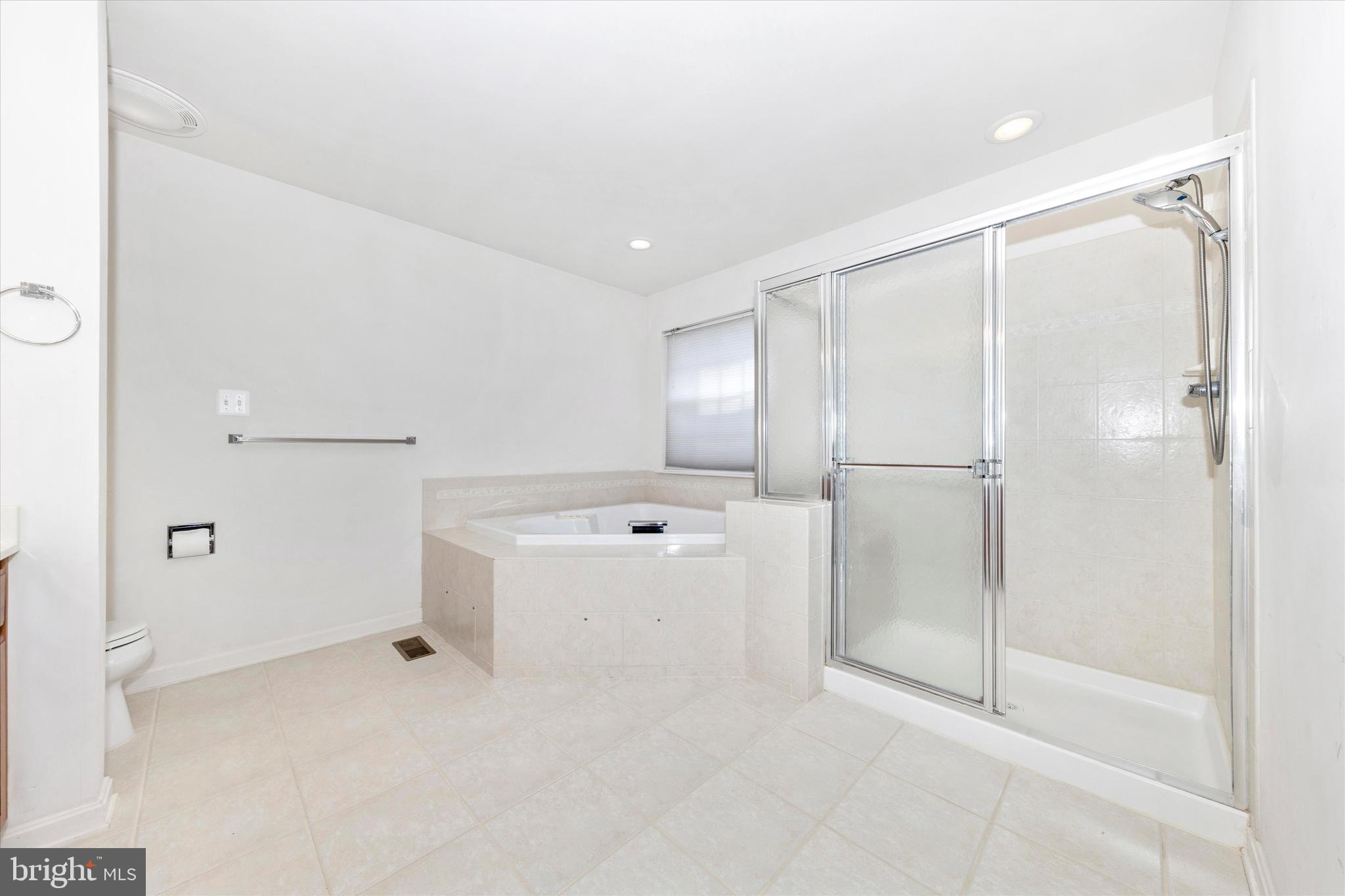 100 Sunlight Drive Frederick, MD 21702 - Photo 13 of 41 a bathroom with a shower and a glass door
