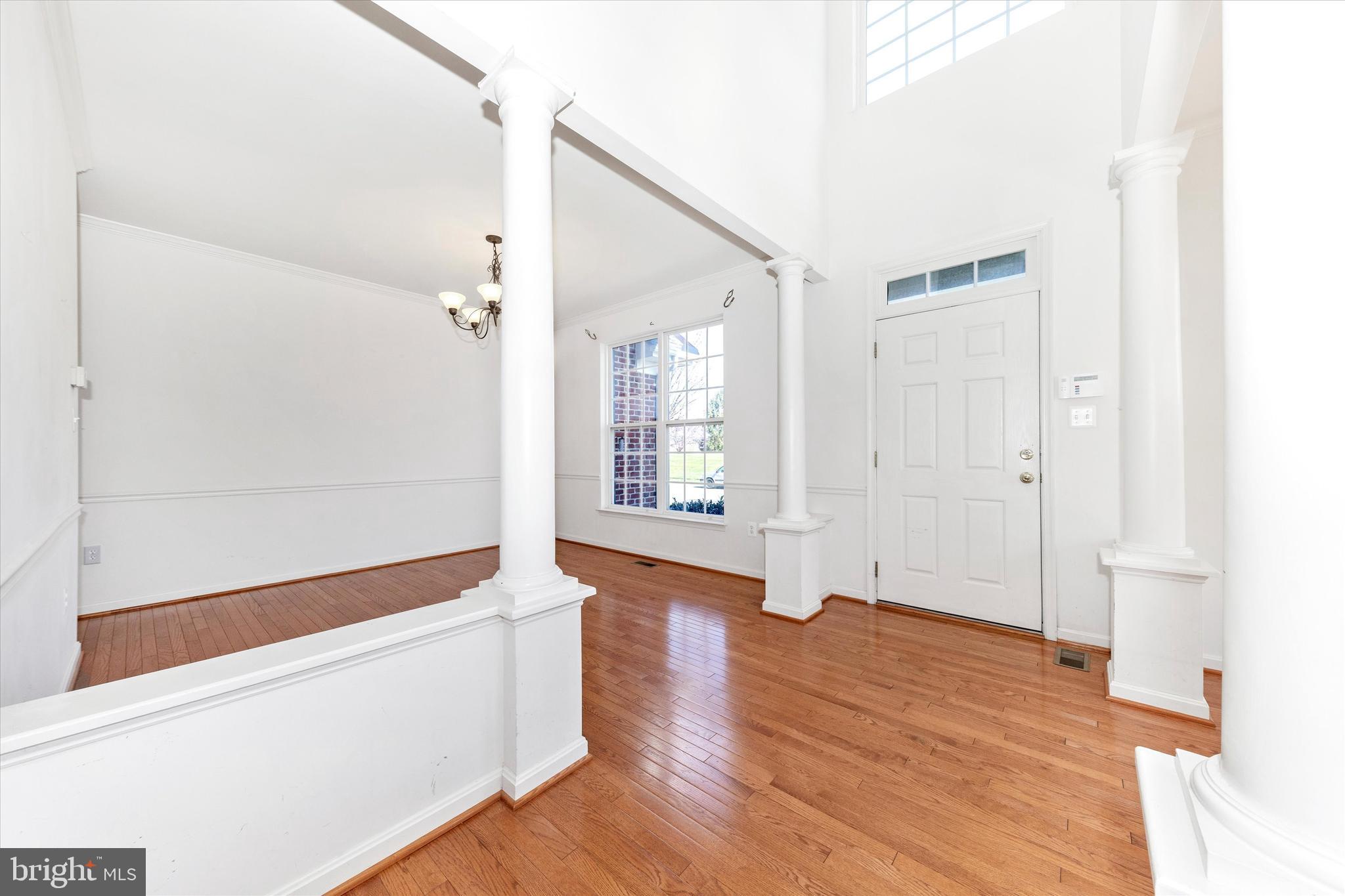 100 Sunlight Drive Frederick, MD 21702 - Photo 2 of 41 a view of an empty room with wooden floor and a window
