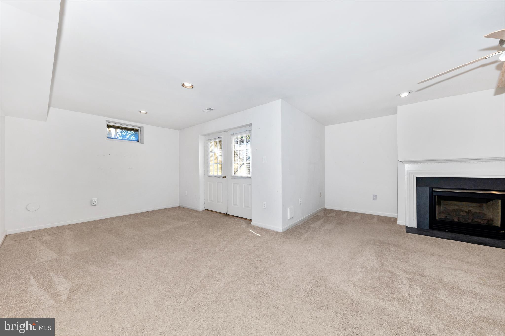 100 Sunlight Drive Frederick, MD 21702 - Photo 24 of 41 an empty room with windows and fireplace
