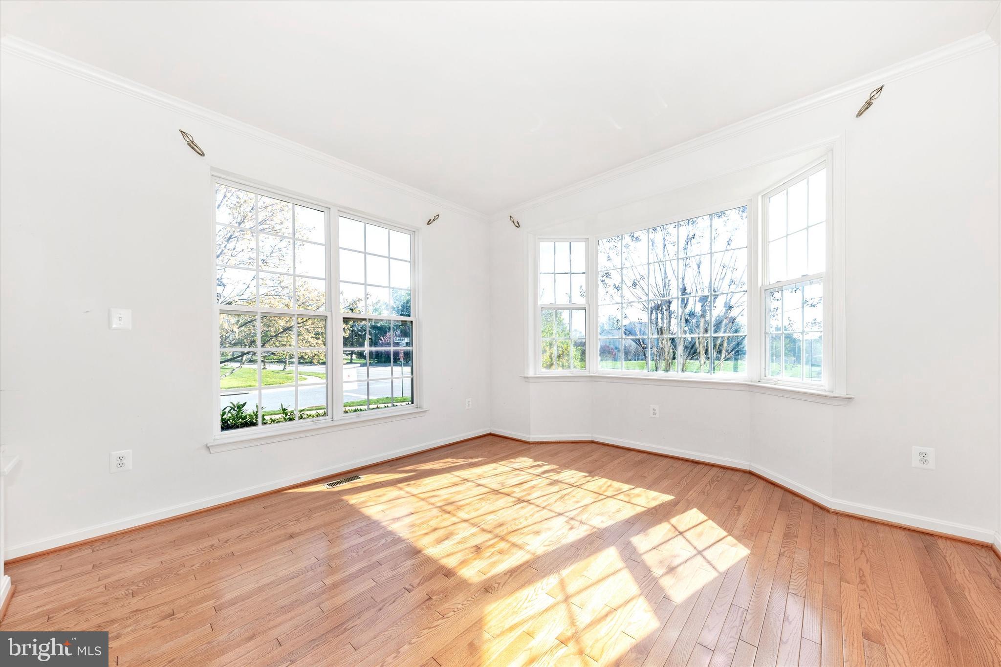 100 Sunlight Drive Frederick, MD 21702 - Photo 3 of 41 a view of an empty room with wooden floor and a window