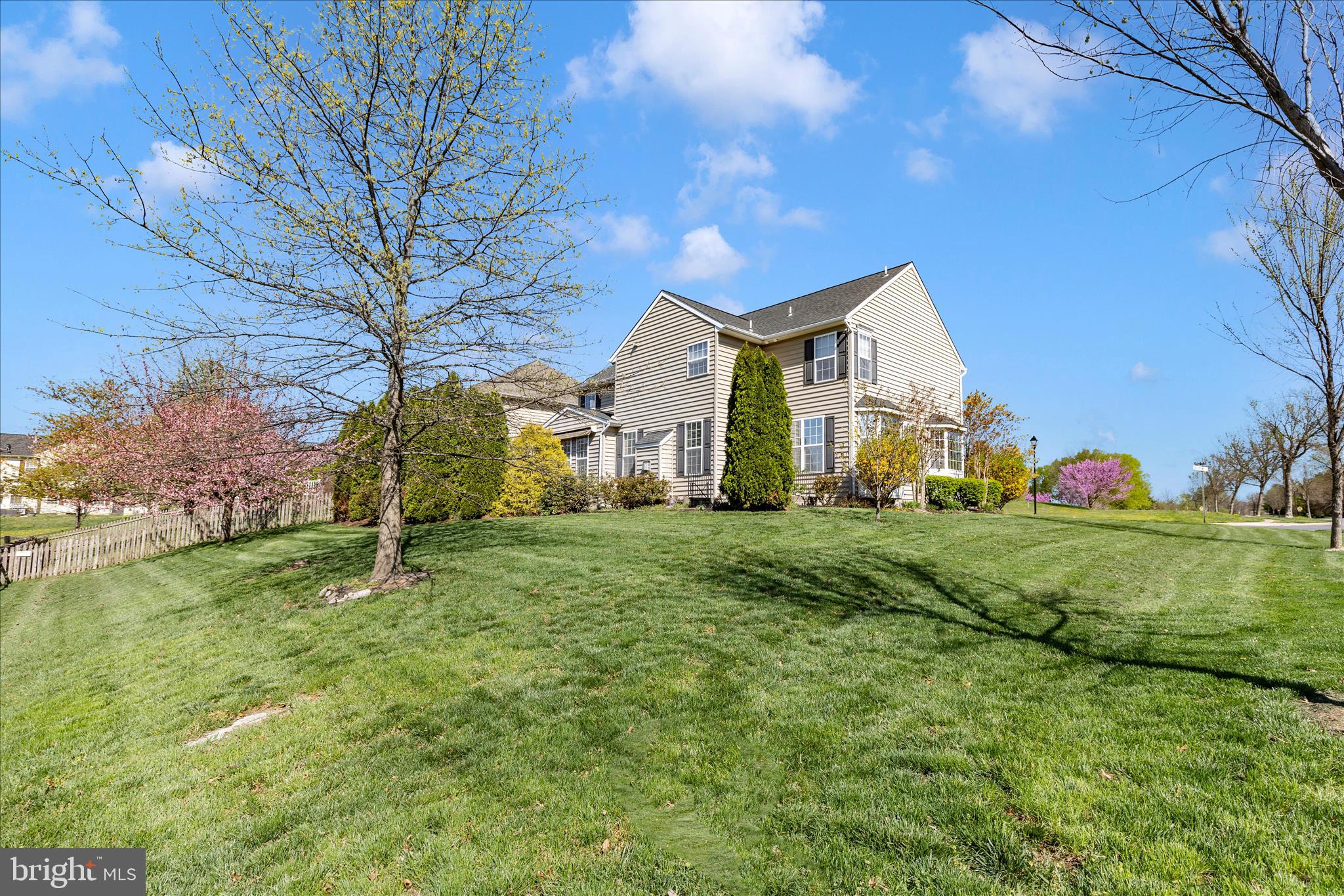 100 Sunlight Drive Frederick, MD 21702 - Photo 32 of 41 a view of a big house with a big yard and large tree