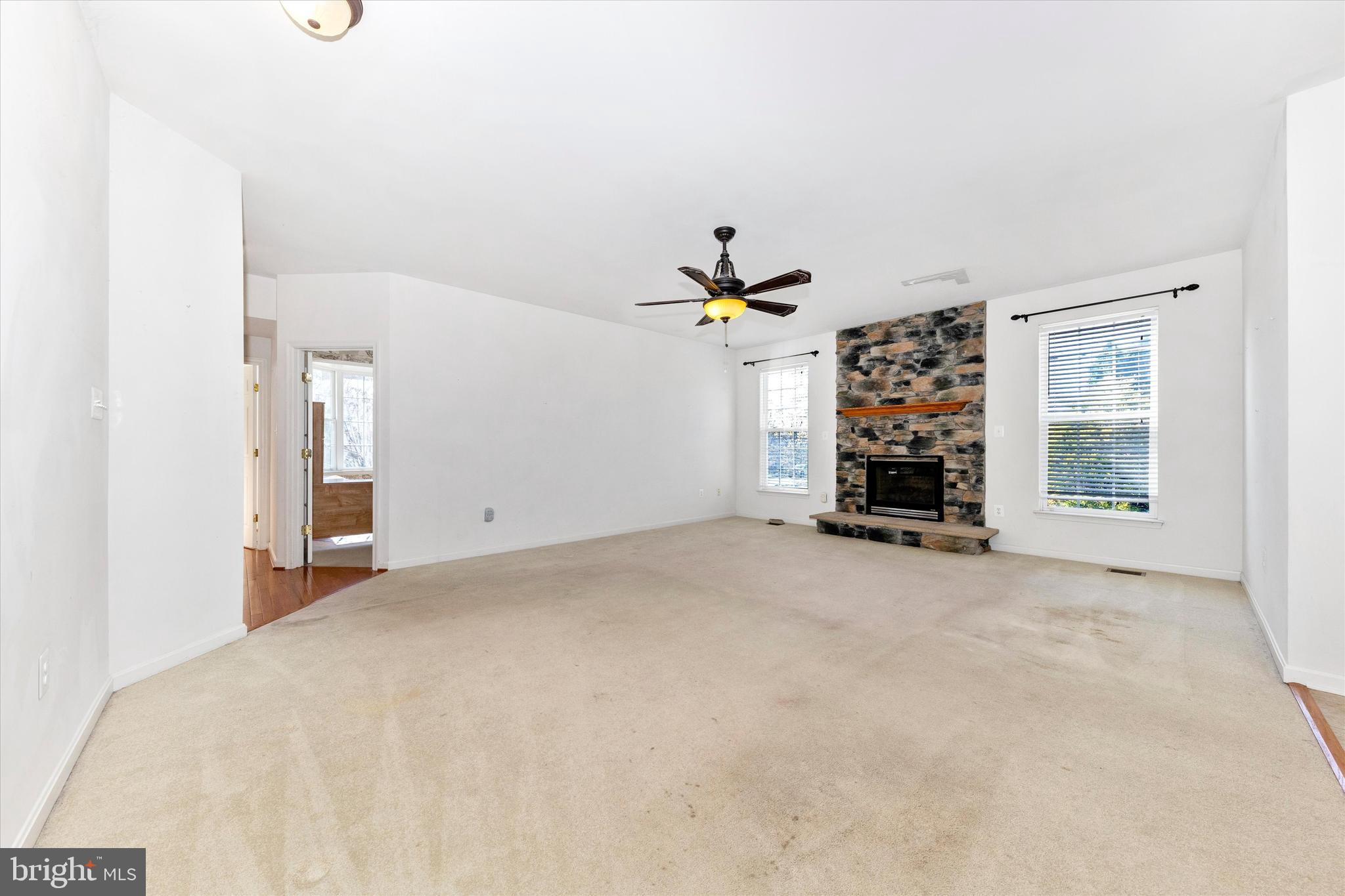 100 Sunlight Drive Frederick, MD 21702 - Photo 7 of 41 an empty room with windows and fireplace