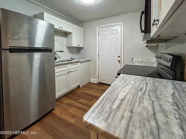a bathroom with a sink toilet and mirror