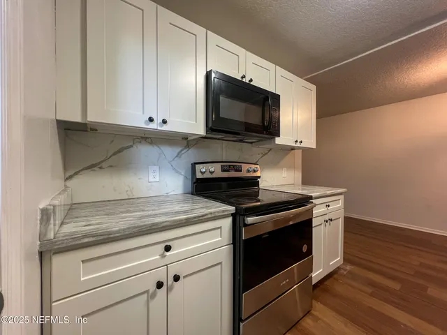 a house that has a tree in front of it