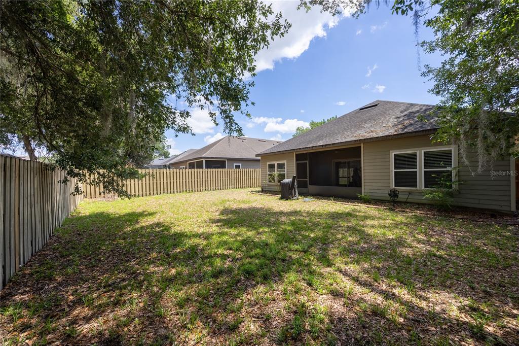 7550 Southwest 81st Way Gainesville, FL 32608 - Photo 29 of 31 a front view of a house with a garden