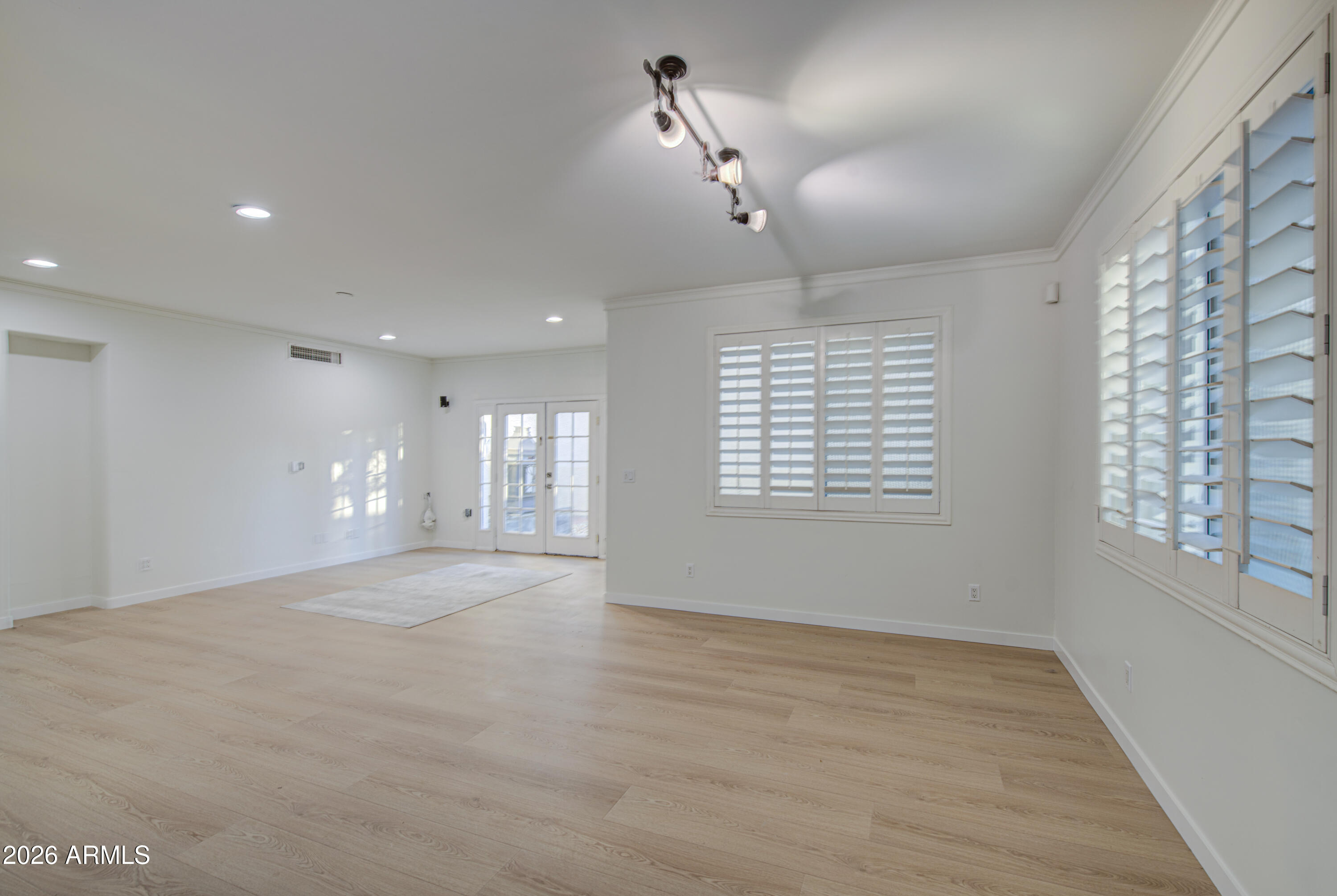 6018 North 5th Place Phoenix, AZ 85014 - Photo 12 of 53 a view of an empty room with a window
