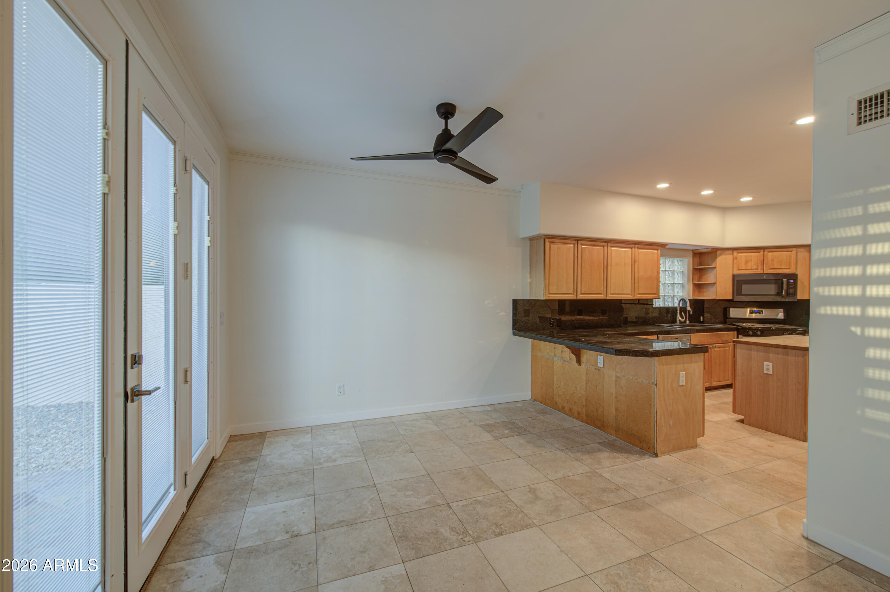 6018 North 5th Place Phoenix, AZ 85014 - Photo 13 of 53 a kitchen with stainless steel appliances granite countertop a refrigerator and a sink
