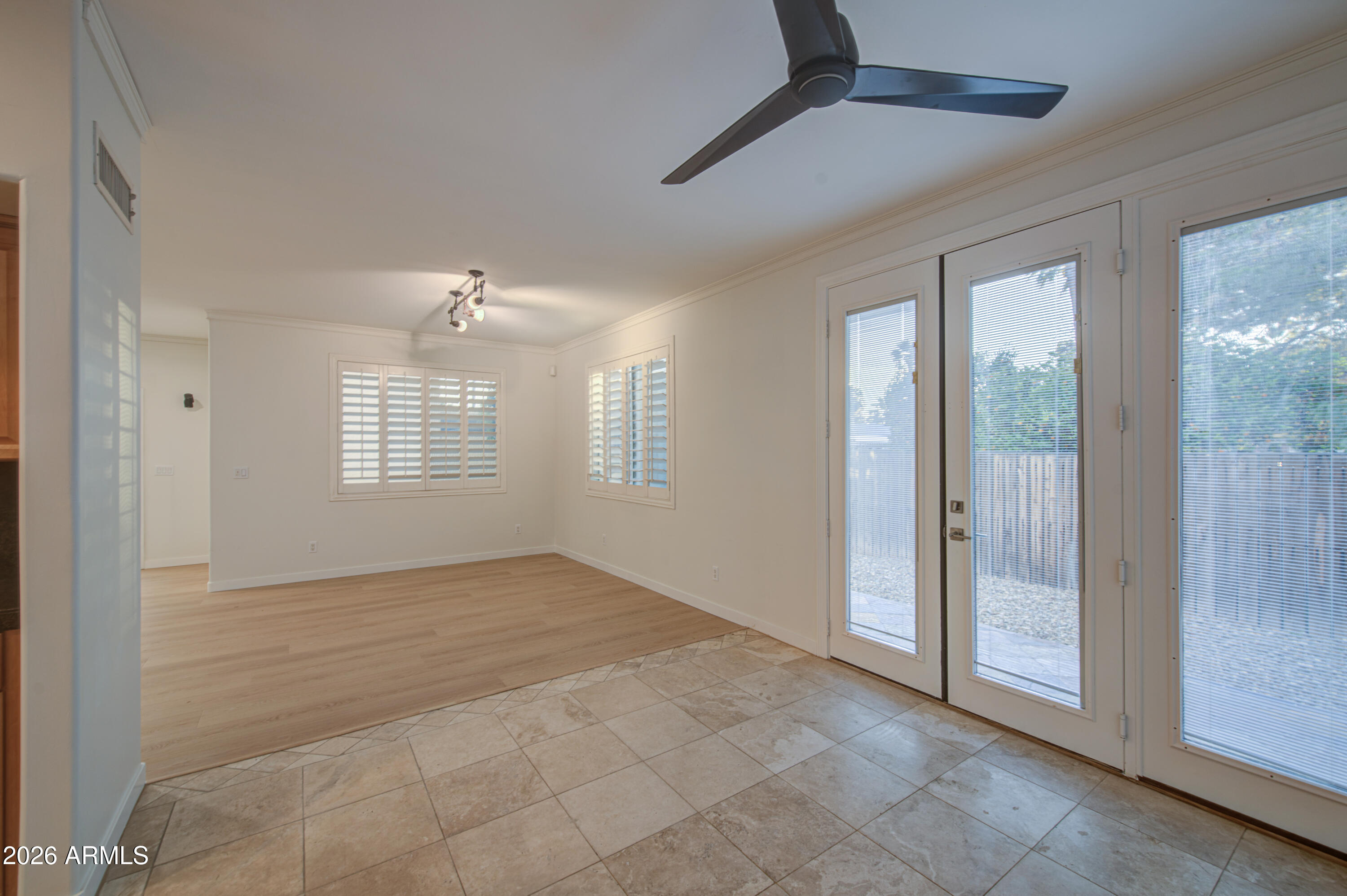 6018 North 5th Place Phoenix, AZ 85014 - Photo 15 of 53 a view of an empty room with glass door