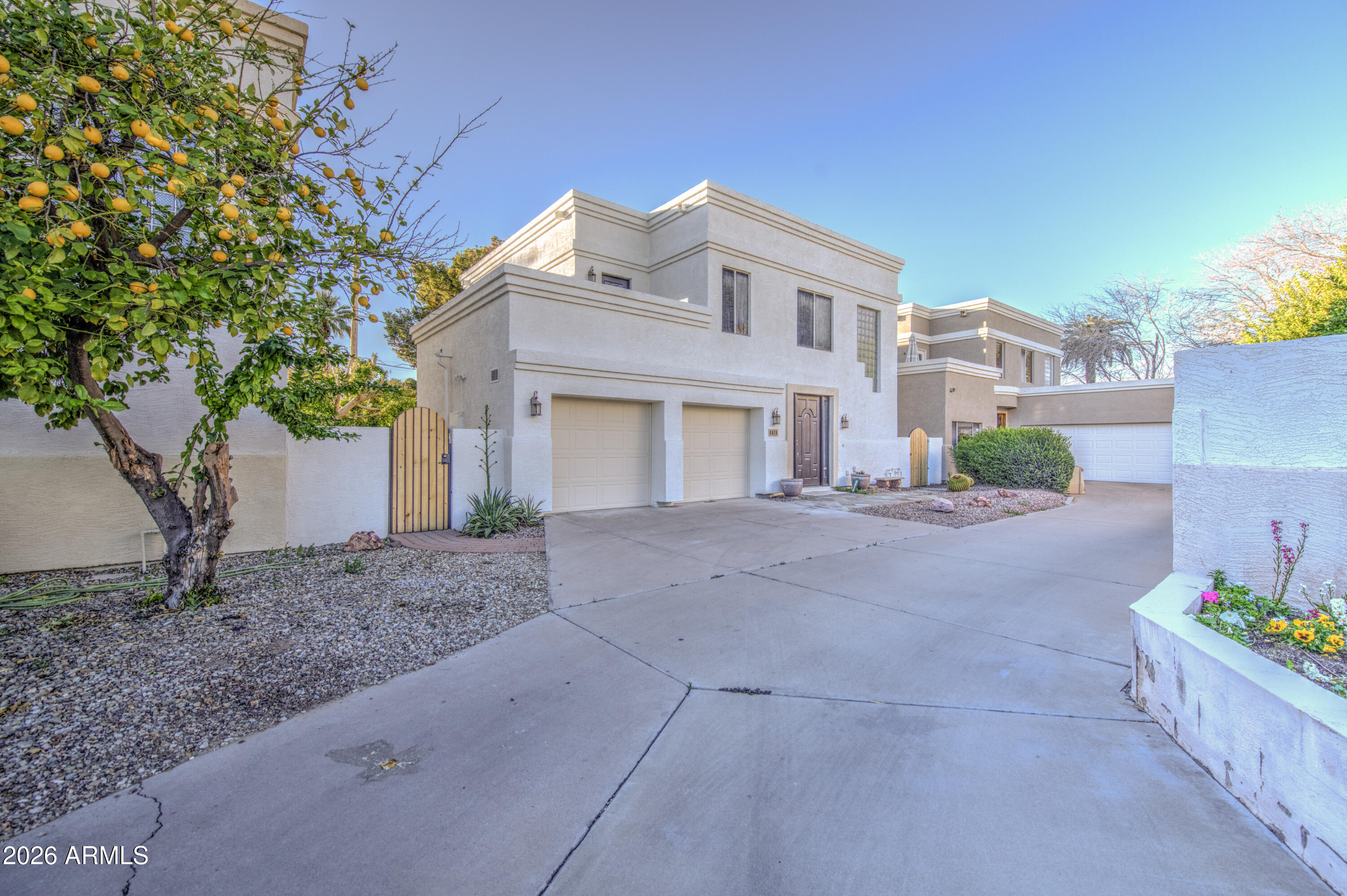 6018 North 5th Place Phoenix, AZ 85014 - Photo 2 of 53 a front view of a house with a yard and garage