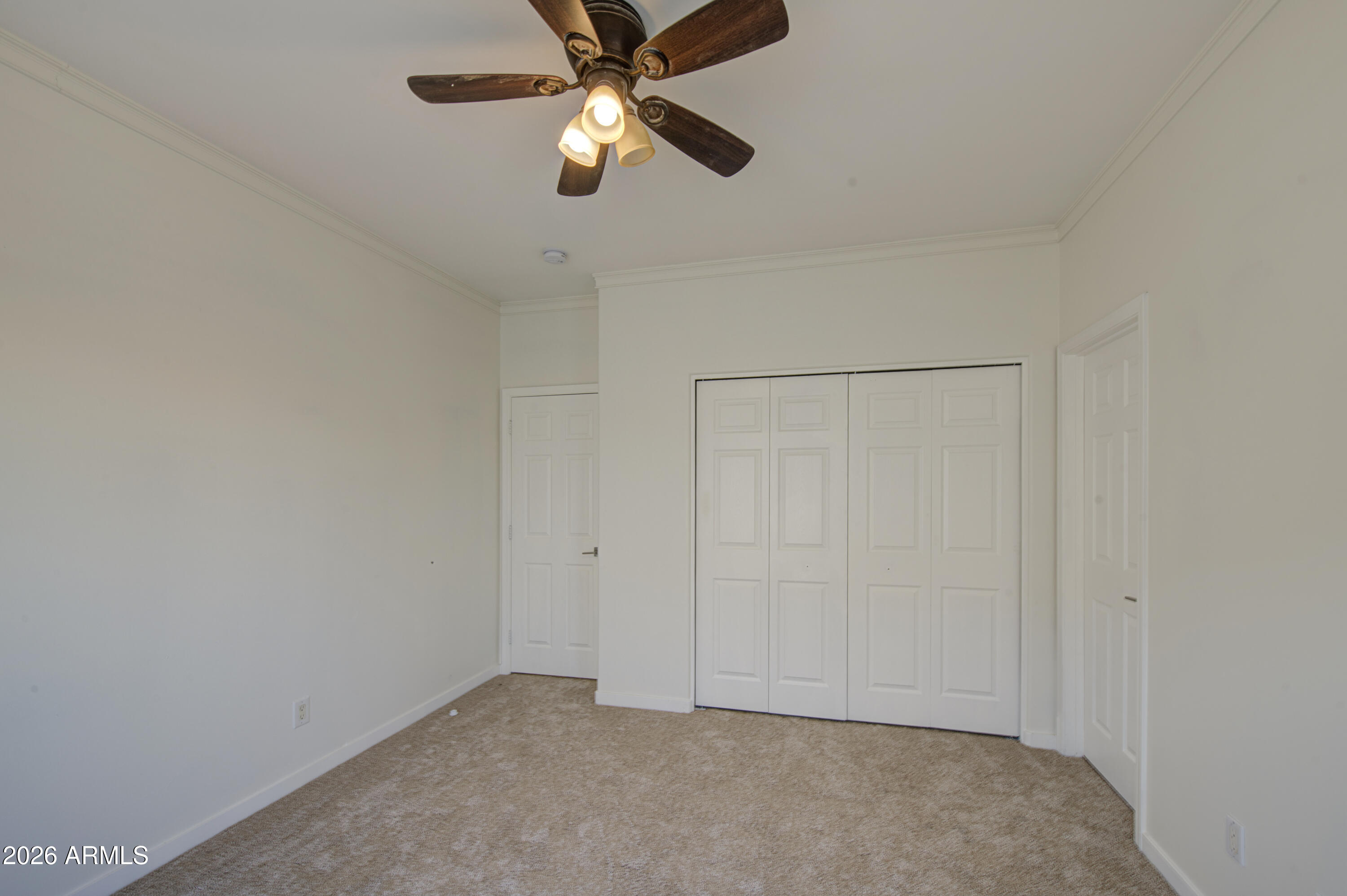 6018 North 5th Place Phoenix, AZ 85014 - Photo 31 of 53 an empty room with closet and a chandelier fan