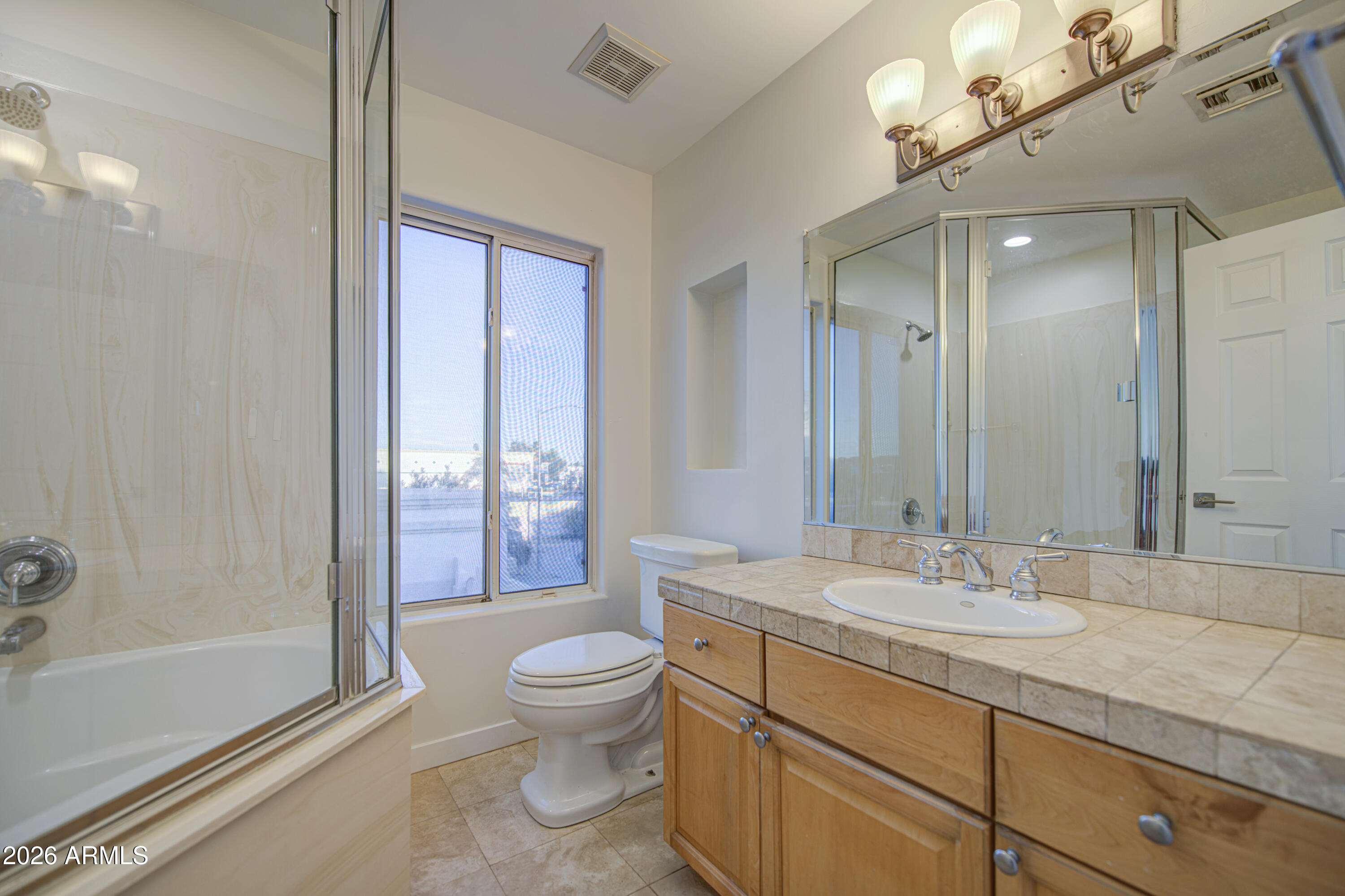 6018 North 5th Place Phoenix, AZ 85014 - Photo 35 of 53 a bathroom with a granite countertop sink toilet and shower