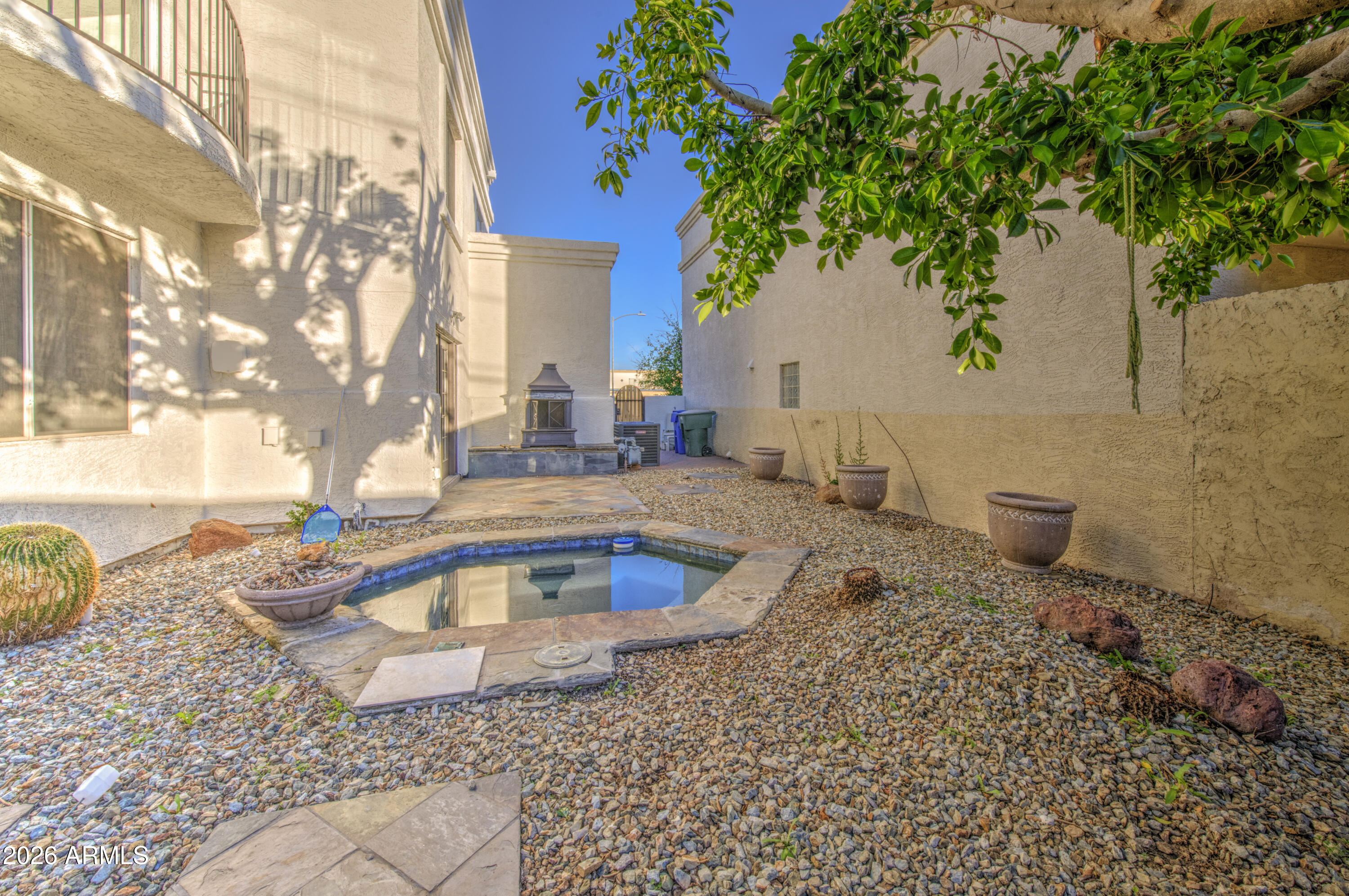 6018 North 5th Place Phoenix, AZ 85014 - Photo 48 of 53 a view of a backyard with plants and a tree
