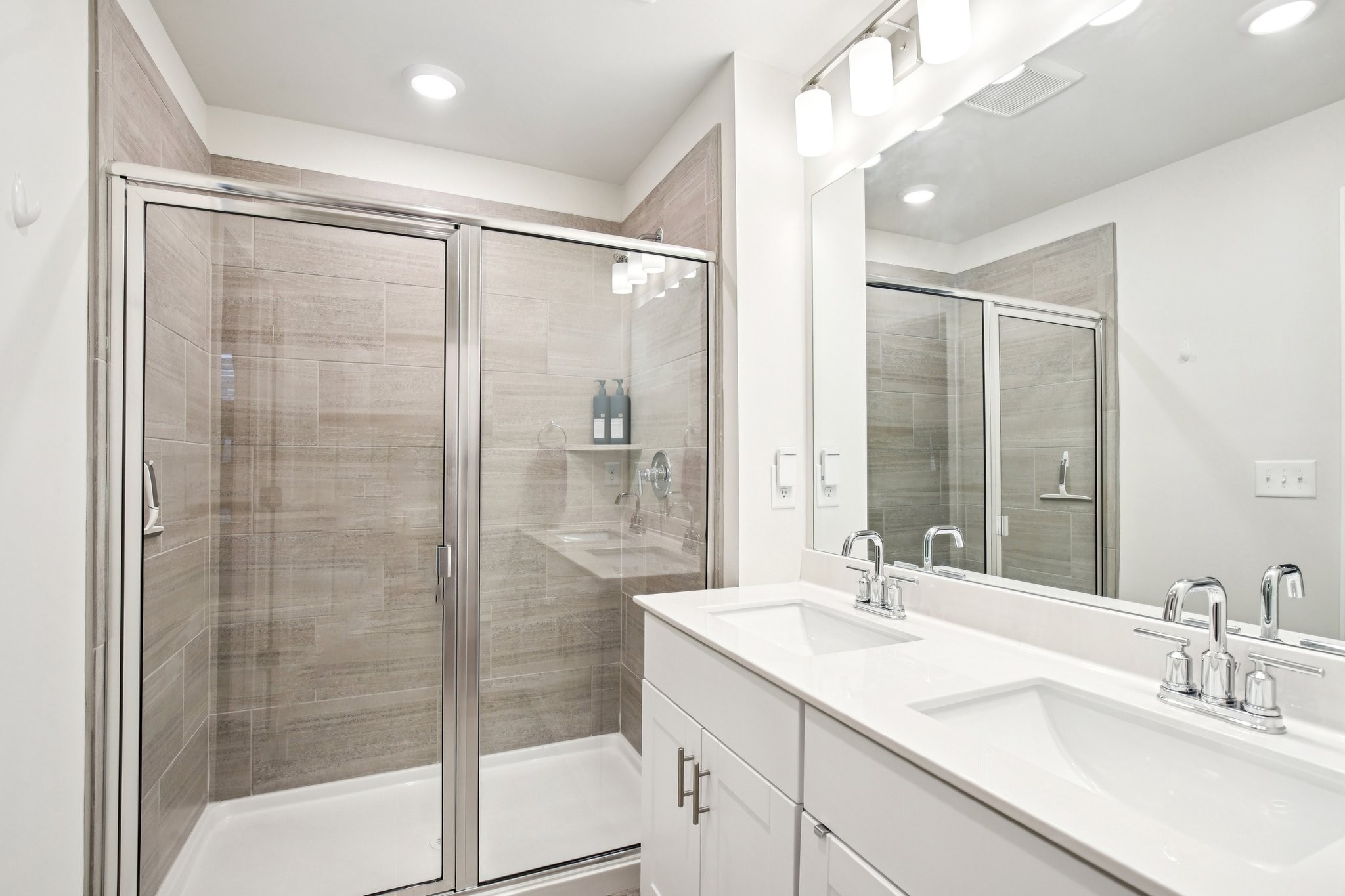 4657 Ridge Bend Drive Nashville, TN 37207 - Photo 14 of 21 a bathroom with a shower sink and mirror