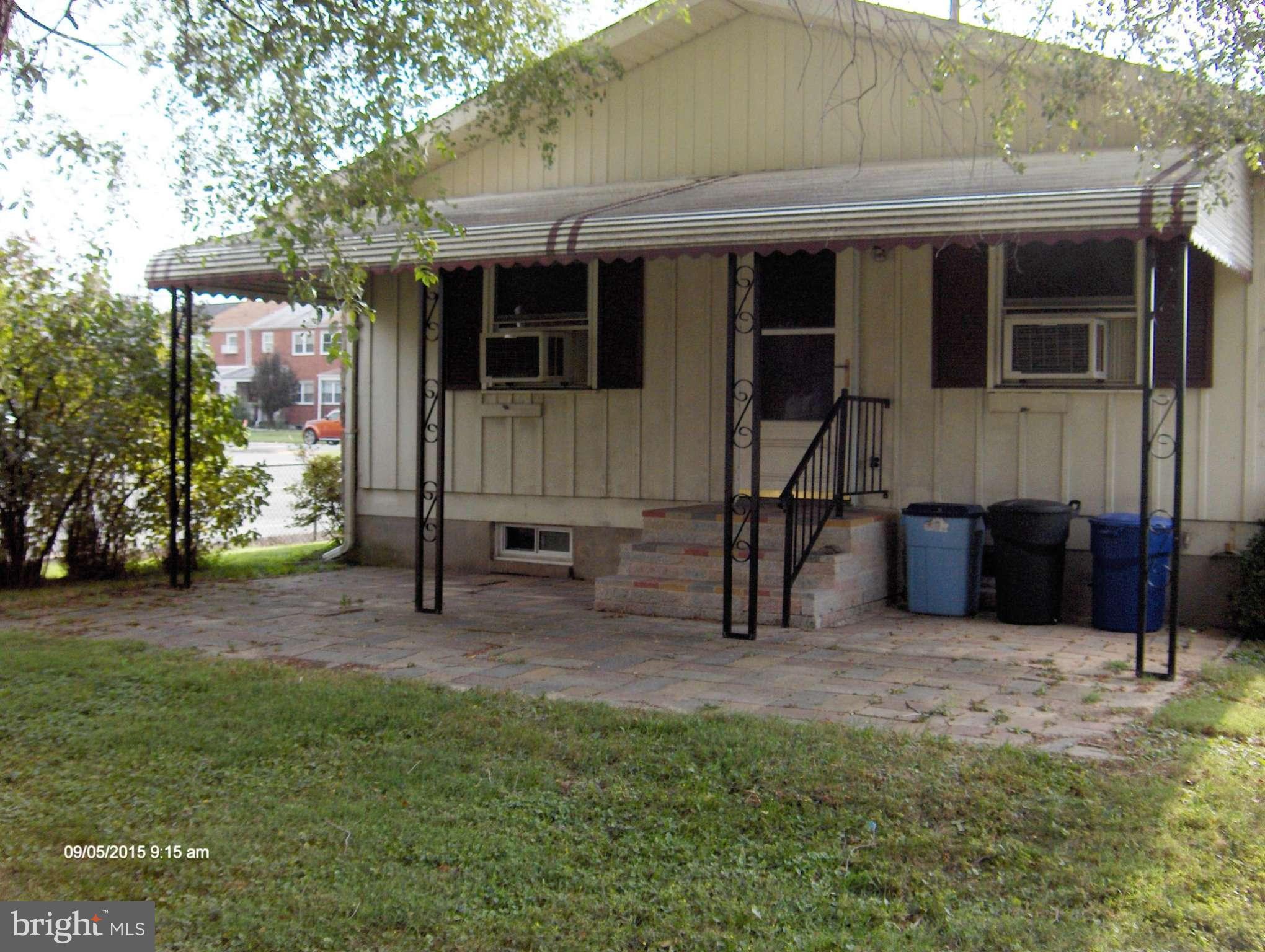 1716 Lynch Road Baltimore, MD 21222 - Photo 3 of 28 a view of a house with a backyard and porch