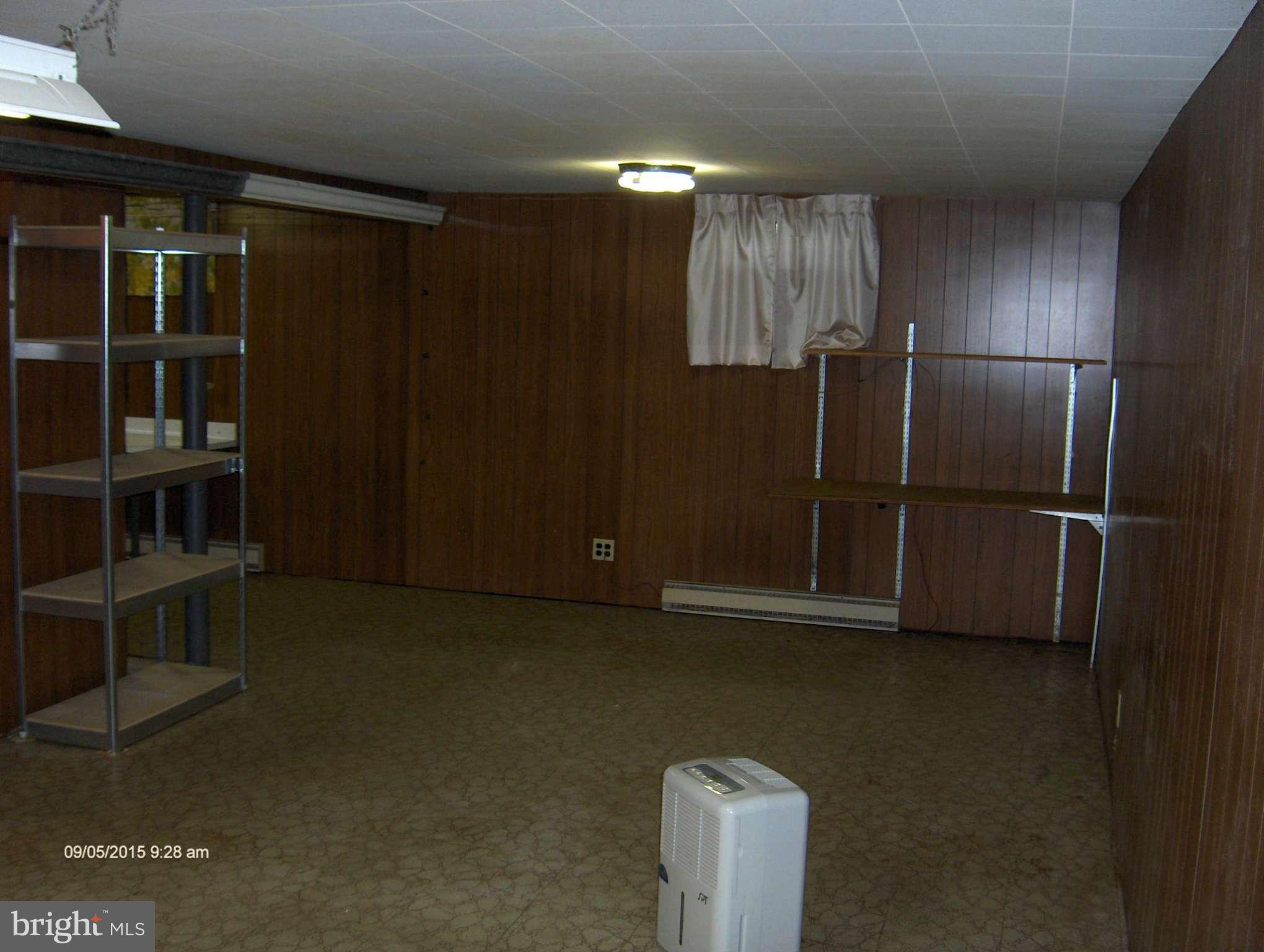 1716 Lynch Road Baltimore, MD 21222 - Photo 22 of 28 a view of an empty room with a kitchen