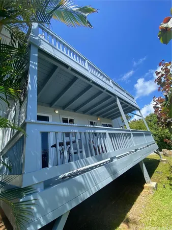 a view of balcony with wooden floor