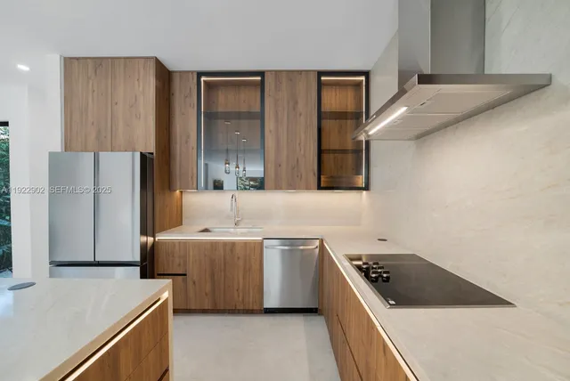 a kitchen with a stove sink and refrigerator