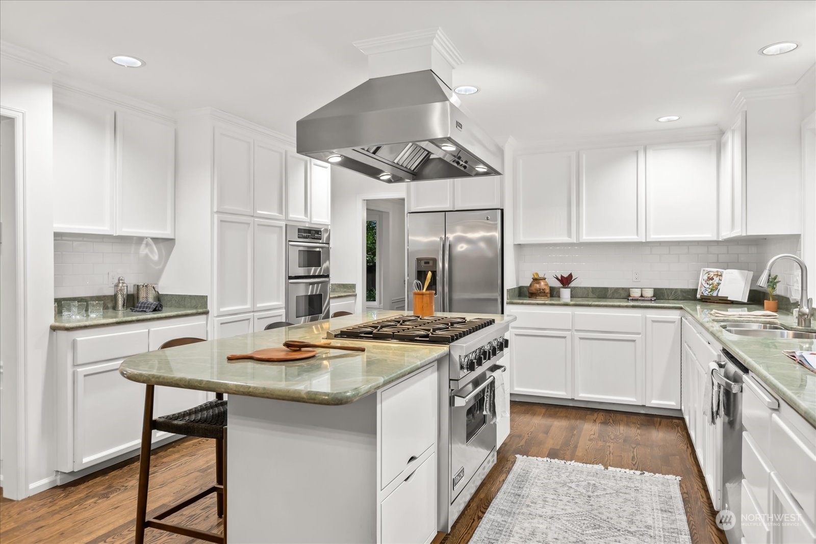 8418 192nd Street Southwest Edmonds, WA 98026 - Photo 12 of 39 a kitchen with stainless steel appliances granite countertop a stove and white cabinets