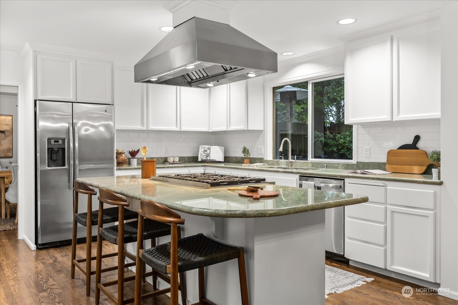 8418 192nd Street Southwest Edmonds, WA 98026 - Photo 14 of 39 a kitchen with stainless steel appliances granite countertop a sink a stove a refrigerator and island