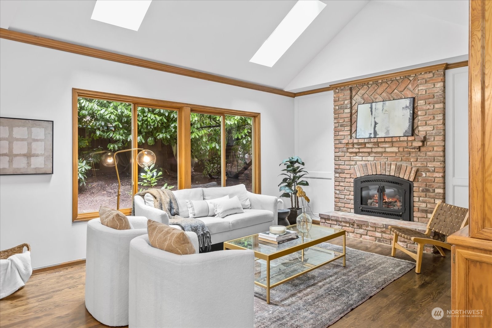 8418 192nd Street Southwest Edmonds, WA 98026 - Photo 16 of 39 a living room with furniture a large window and a fireplace