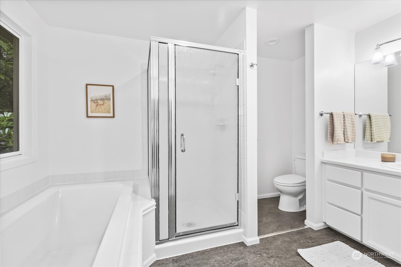 8418 192nd Street Southwest Edmonds, WA 98026 - Photo 22 of 39 a bathroom with a bathtub shower sink mirror and toilet