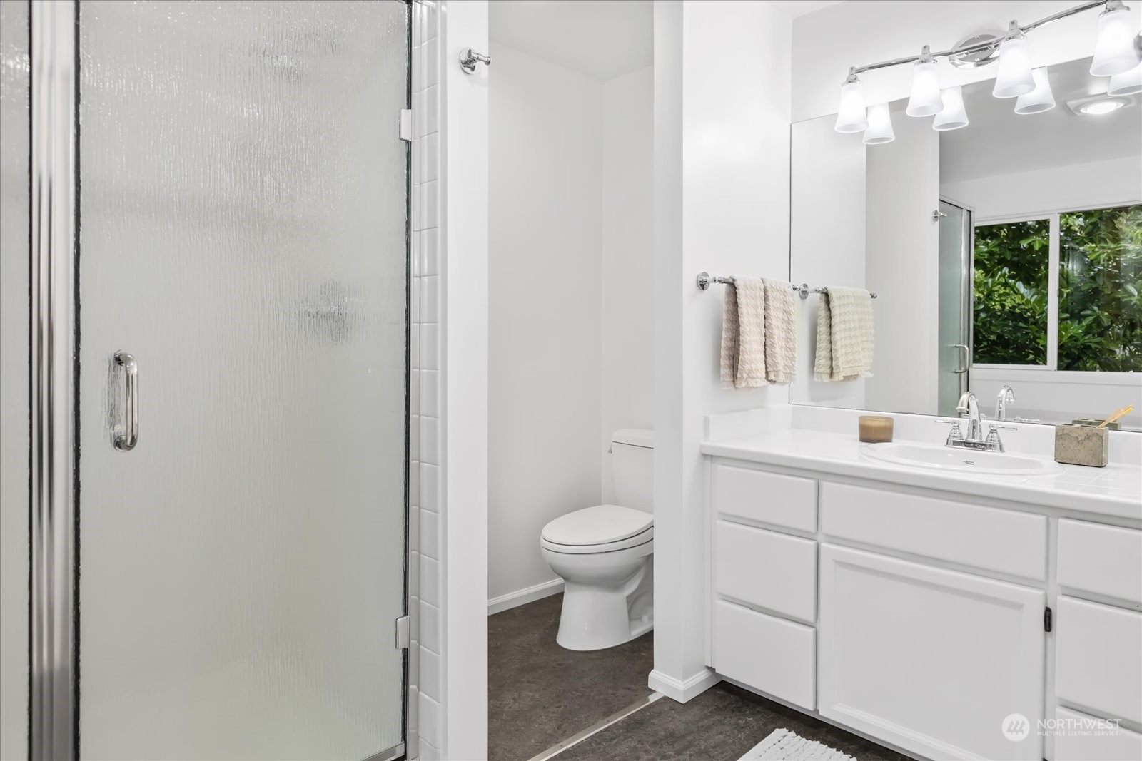 8418 192nd Street Southwest Edmonds, WA 98026 - Photo 23 of 39 a bathroom with a toilet sink and mirror