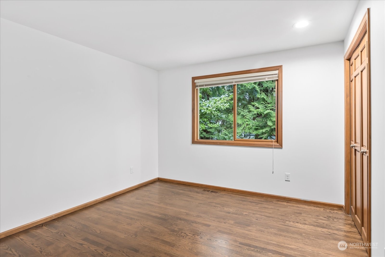 8418 192nd Street Southwest Edmonds, WA 98026 - Photo 24 of 39 an empty room with wooden floor and windows