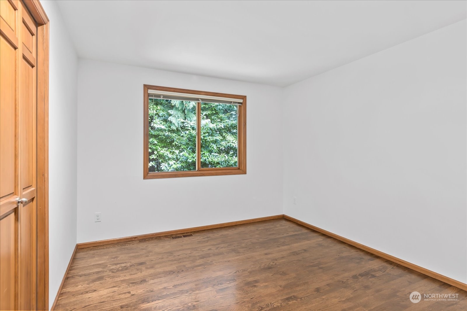 8418 192nd Street Southwest Edmonds, WA 98026 - Photo 26 of 39 an empty room with wooden floor and windows