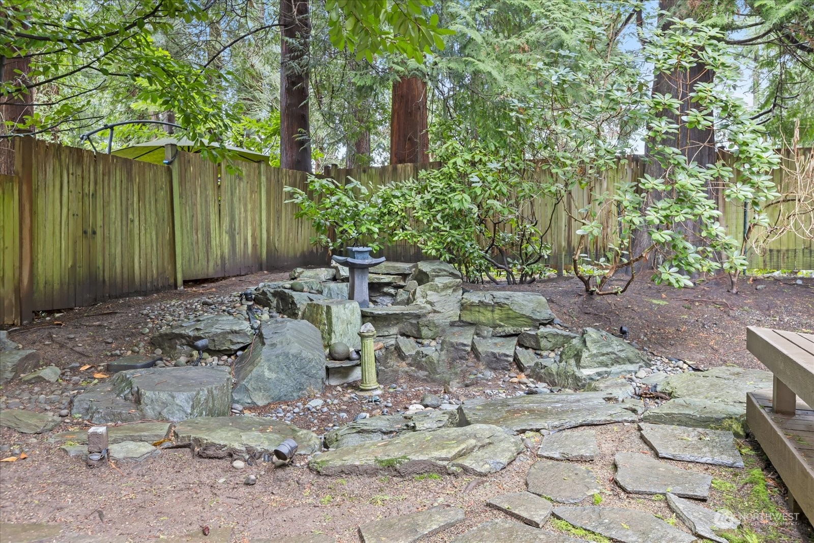 8418 192nd Street Southwest Edmonds, WA 98026 - Photo 32 of 39 a view of a backyard with plants and large trees