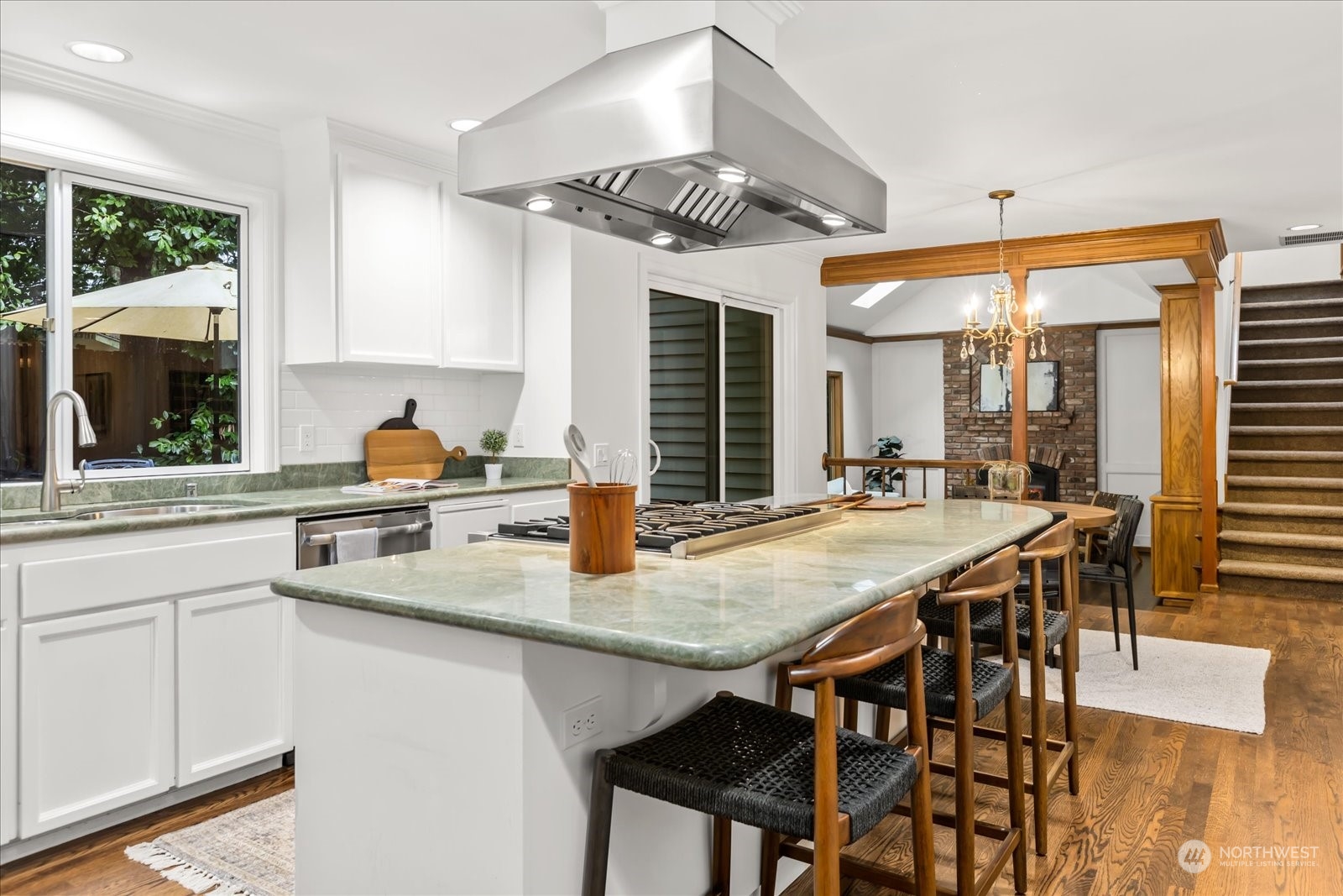 8418 192nd Street Southwest Edmonds, WA 98026 - Photo 10 of 39 a kitchen with a table chairs stove and cabinets