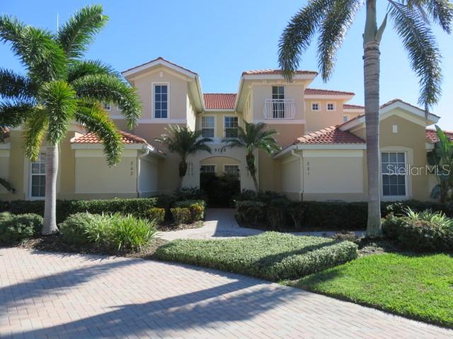 9720 Sea Turtle Terrace, Unit 201 Bradenton, FL 34212 - Photo 1 of 29 a front view of house with yard and green space