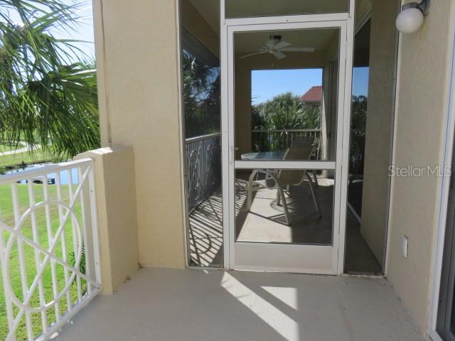 9720 Sea Turtle Terrace, Unit 201 Bradenton, FL 34212 - Photo 15 of 29 a view of a door and chair