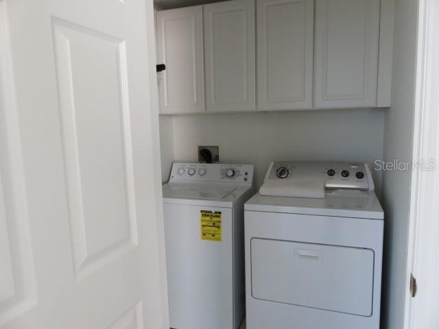 9720 Sea Turtle Terrace, Unit 201 Bradenton, FL 34212 - Photo 16 of 29 a utility room with dryer and washer