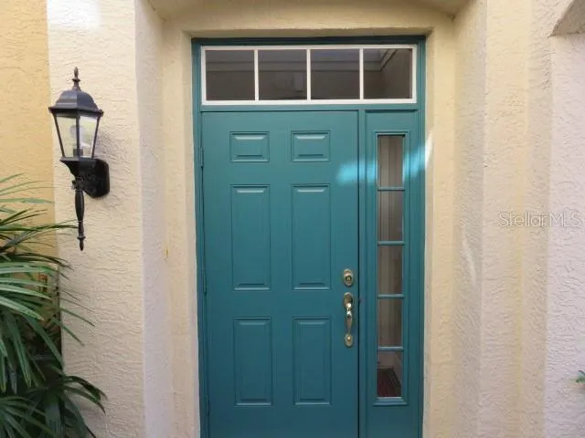 a view of a swimming pool with a patio and couches