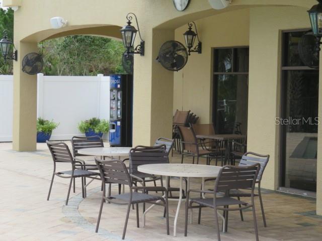 9720 Sea Turtle Terrace, Unit 201 Bradenton, FL 34212 - Photo 20 of 29 a view of a dining room with furniture window and wooden floor