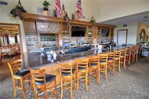 9720 Sea Turtle Terrace, Unit 201 Bradenton, FL 34212 - Photo 22 of 29 a view of a dining room with furniture
