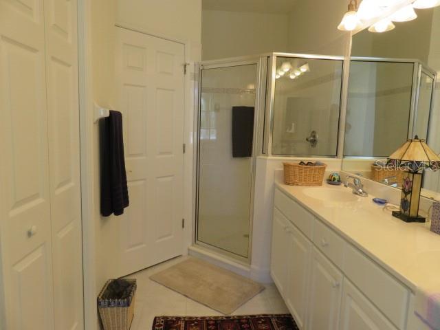 9720 Sea Turtle Terrace, Unit 201 Bradenton, FL 34212 - Photo 8 of 29 a bathroom with a sink and mirror