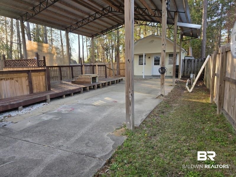 182 Defuniak Loop Lillian, AL 36549 - Photo 5 of 21 Fenced backyard featuring a deck