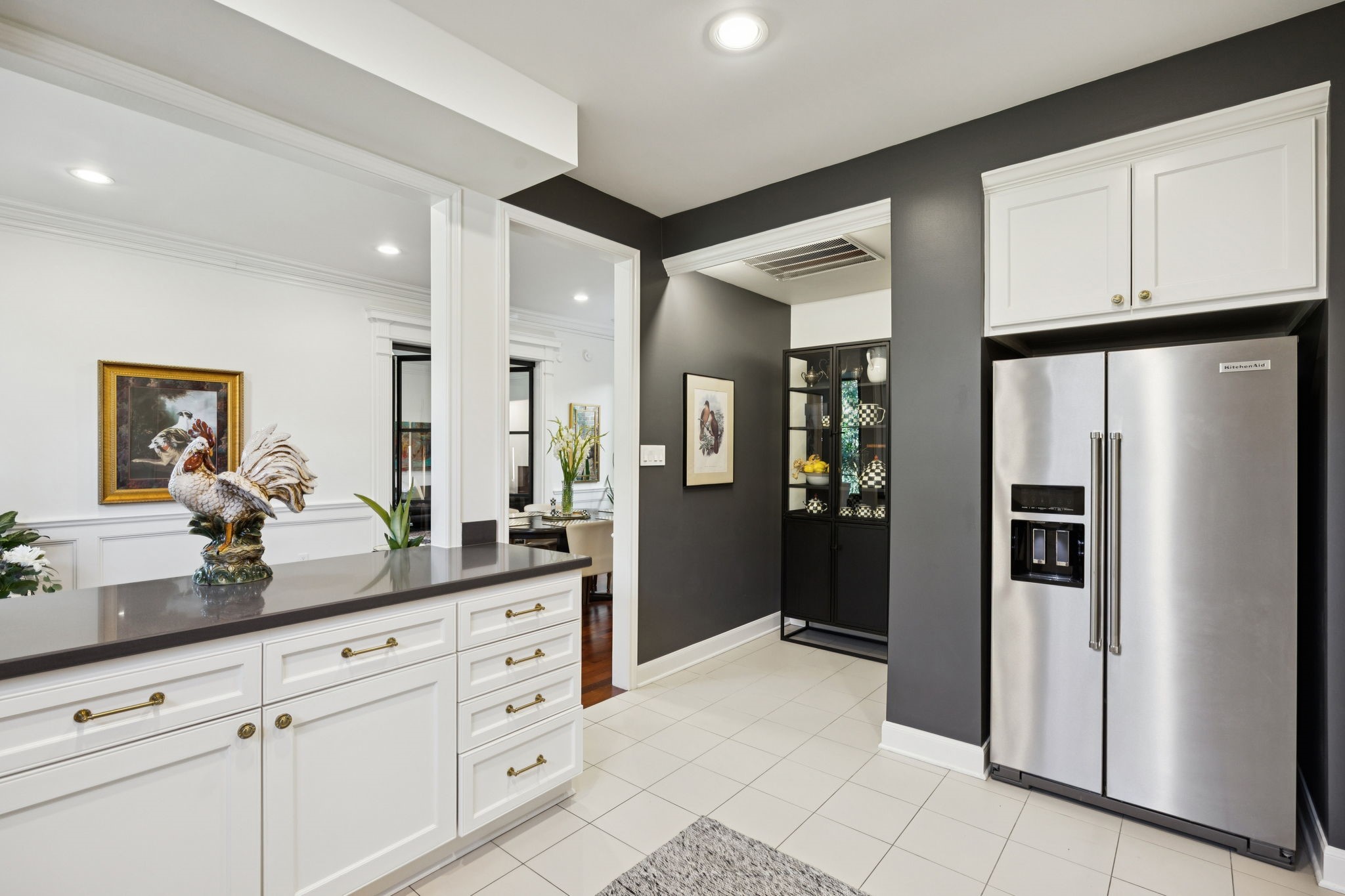 4964 Post Oak Timber Drive Houston, TX 77056 - Photo 20 of 48 a kitchen with white cabinets and refrigerator