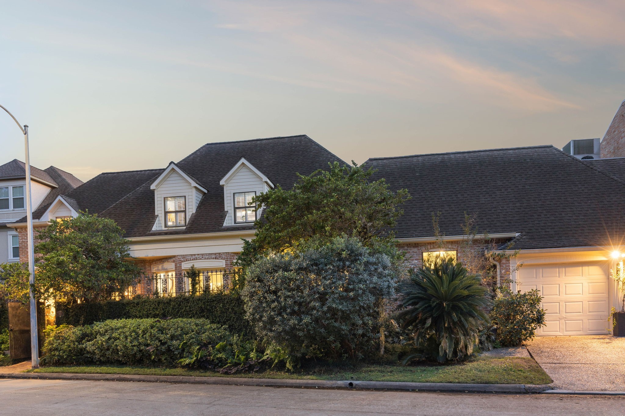 4964 Post Oak Timber Drive Houston, TX 77056 - Photo 40 of 48 a front view of a house with plants and trees