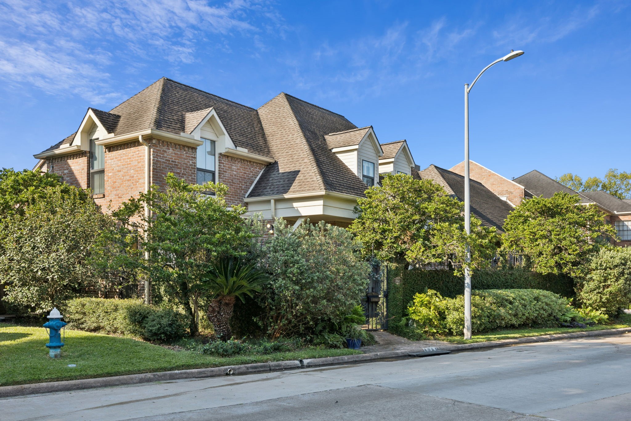 4964 Post Oak Timber Drive Houston, TX 77056 - Photo 4 of 48 a view of a house with a yard and plants