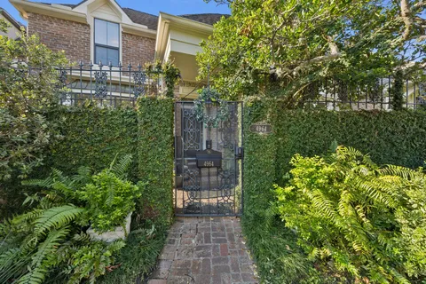 a view of a pathway both side of the house