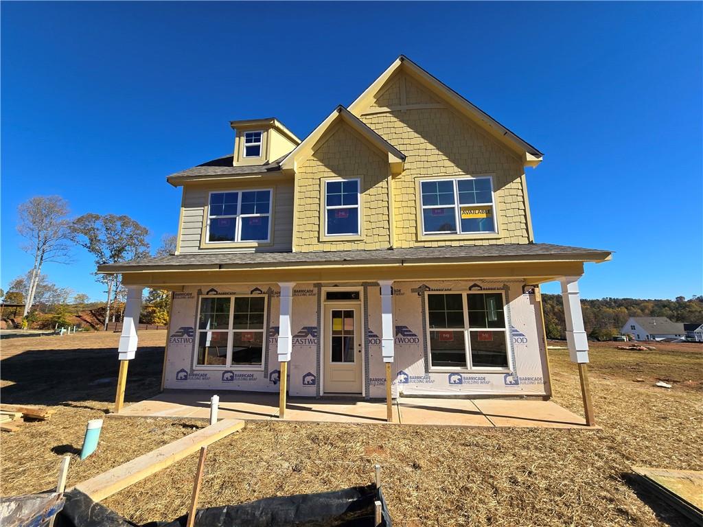 154 Marble Tree Way Ball Ground, GA 30107 - Photo 2 of 9 a front view of a house with a yard
